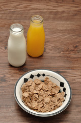 Breakfast with cereal, milk, orange juice