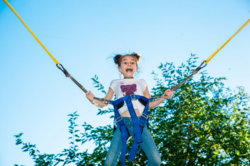 Girl jumping on a trampoline