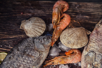 Food wooden background with Seafood, sticks, lime, salt. Copy sp