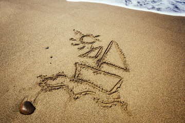 Ship painted on sand beach