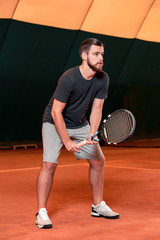 young sportsman playing tennis