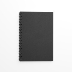 Black paper notebook made of craft paper over white background. Top view. 3d rendering.