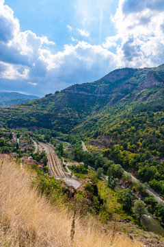 Panoramic view from a hill top - beautiful landscape at Balkan mountains, Bulgaria, close to the village of Bov - green trees and clear blue sky