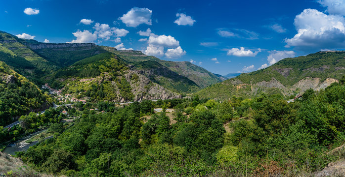 Panoramic view from a hill top - beautiful landscape at Balkan mountains, Bulgaria, close to the village of Bov - green trees and clear blue sky