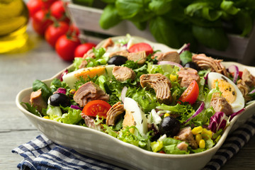 Tuna salad with lettuce, eggs and tomatoes.