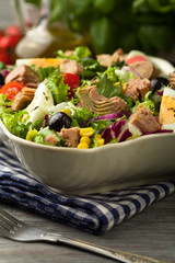 Tuna salad with lettuce, eggs and tomatoes.