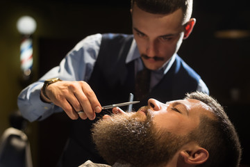 Grooming beard in a Barbershop