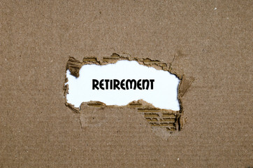 The word retirement appearing behind torn paper