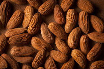 Almonds on wooden background
