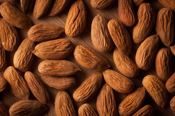Almonds on wooden background