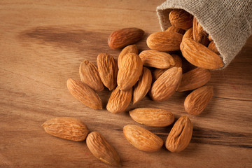 Almonds on wooden background