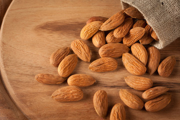 Almonds on wooden background
