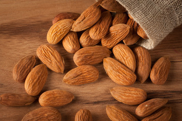 Almonds on wooden background