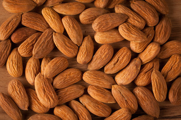 Almonds on wooden background