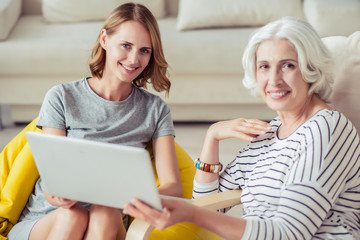 Positive woman resting with her granddaughter