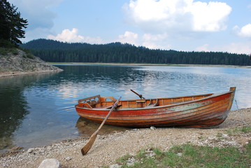 Wooden boat with oars on Crno Jezero in Montenegro © dagabu
