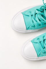 Top view of sneakers on white background.