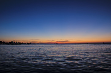 SUNRISE OVER THE SEA. Sunny dawn in the port of Gdynia