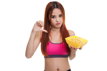 Obraz premium Asian healthy girl thumbs down with french fries.