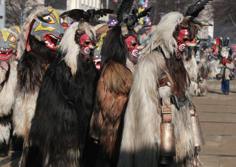PERNIK, BULGARIA - JANUARY 30, 2016 - Masquerade festival Surva in Pernik, Bulgaria. People with mask called Kukeri dance and perform to scare the evil spirits