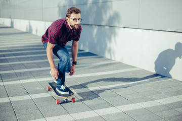 Beard skateboarder in ride
