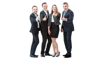 Successful business team. Full length of group of confident business people showing thumbs up standing close to each other and smiling. Isolated on white.