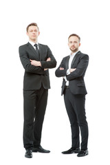 Successful business tandem. Full length of two confident businessmen in formal wear standing close to each other. Isolated on white.
