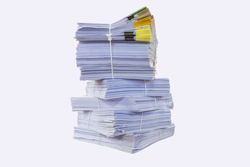 close up of stack of papers on white background