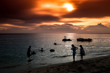 Naklejka na ściany i meble Silhouette People and Jet-ski with sunset background at Bang sean beach ,Chonburi Thailand