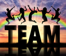 Silhouette people jumping over the word team