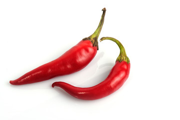 red chili peppers - hot spices on white background 