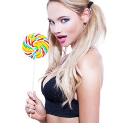 Sexy blonde woman with colorful lollipop isolated