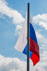 Russian flag on the beautiful sky