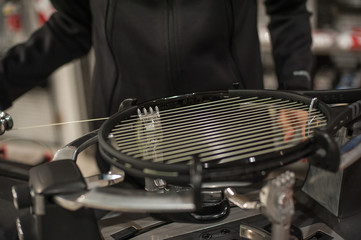 Racket stringing. Detail of tennis racket in the stringing machine