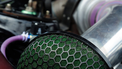 Car air filter zero resistance. element of a sports car tuning. photo toned.