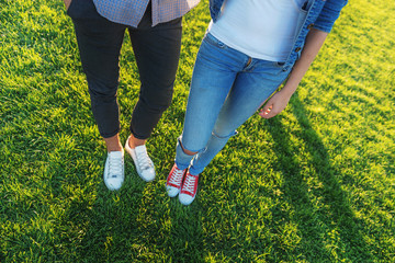 two friends standing in sneakers outdoors - Powered by Adobe