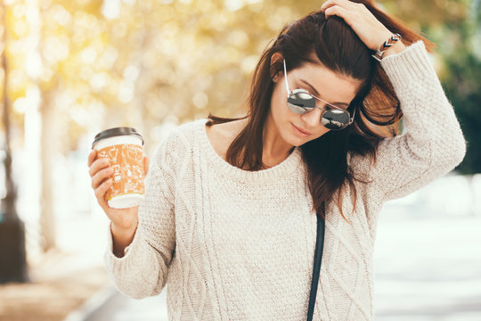 Woman Walking With Take Away Coffee