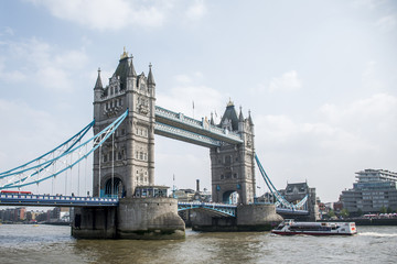 Fototapeta na wymiar London City historic big Tower bridge with boat