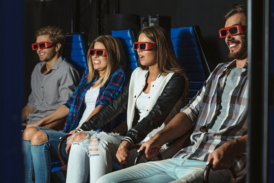 friends sitting in 3D glasses