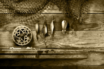 Set for fishing on the shelf. Toned sepia.