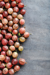 Gooseberries fruit on a grey table
