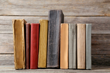 Old antique books on grey wooden table