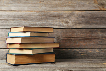 Old antique books on grey wooden table