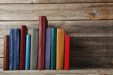 Old antique books on grey wooden table