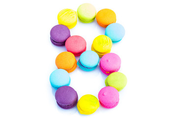 Colorful macarons,number 8 on white background