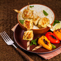 Chicken Kebab or Kabob Skewers with Rice. Selective focus. 