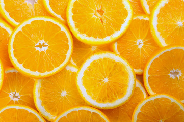 citrus background. juicy slices of  orange cover the entire surface.