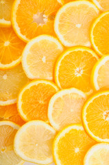 citrus background. juicy slices of lemon and orange cover the entire surface.