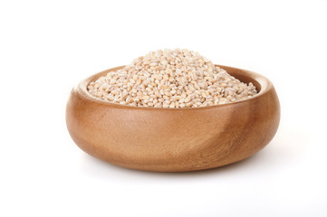 pearl barley in a wooden bowl. for healthy cooking ingredient