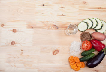 vegetables and cereals and notebook on a wooden table. Healthy E